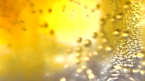 Macro-Coffee-With-Tonic-Soda,-Sparkling-Air-Bubbles-Rising-in-a-Glass-of-Bright-Yellow-Golden-Fluid-Liquid