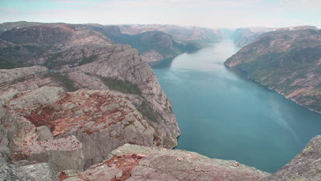 A-cinematic-view-of-cliff-Preikestolen-in-fjord-Lysefjord---Norway---nature-and-travel-background-time-lapse