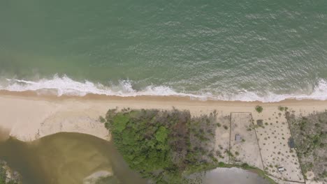 Top-down-aerial-footage-of-beach-and-waves-in-Sierra-Leone-Africa