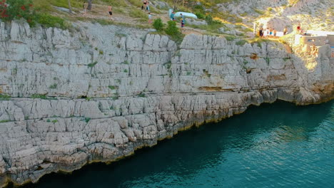 Rocky-Wall-Of-Cliffs-In-The-Adriatic-Coast-In-Klancac-Beach-In-Brsec,-Croatia