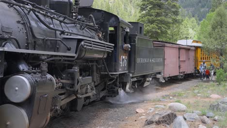 Black-train-engine-performing-a-blowdown-in-the-wilderness