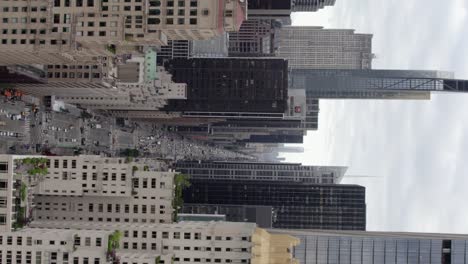 6th-Ave-of-the-Americas,-in-cloudy-New-York,-USA---Vertical,-tracking,-Aerial