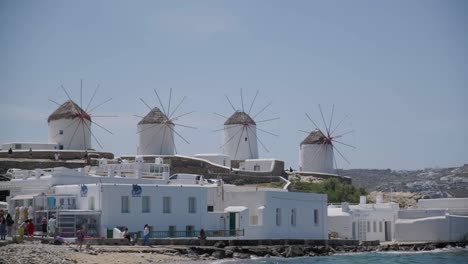Mykonos-Five-Traditional-Windmill-Blue-Sky-4k-30fps-Pan-Right