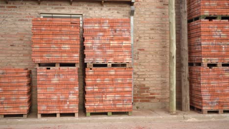 Pallets-of-orange-bricks-for-construction