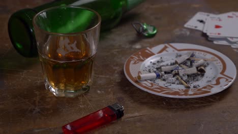 Table-with-beer-cards-and-ashtray-slider-shot