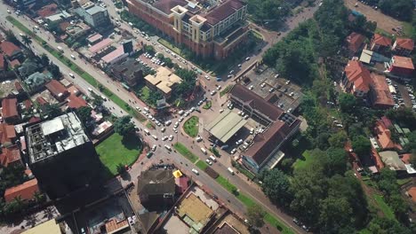 Birds-eye-view-of-Acacia-Mall-shopping-centre-and-city-buildings-in-Kampala,-urban-scene-from-Uganda