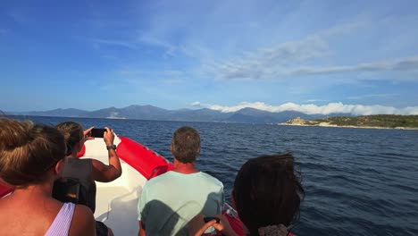 Fpv-pov-of-motorboat-bow-running-fast-over-north-Corsica-sea-water-for-tour-with-tourists-on-board