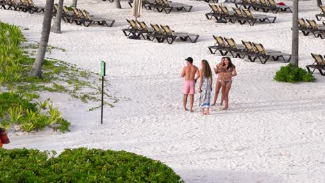 Group-of-young-adults-talking-at-all-inclusive-resort