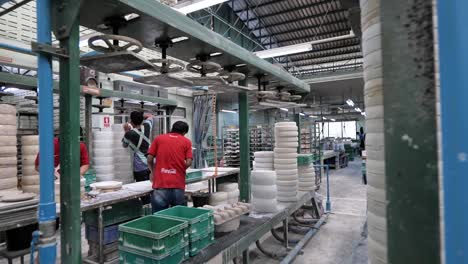 Asian-Workers-Working-in-Ceramic-Factory,-Wide-Shot