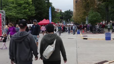 People-walking-at-Taste-of-Madison-event-in-Madison,-Wisconsin-with-timelpase-video
