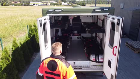 Medic-opens-the-back-of-an-ambulance-made-for-ukraine