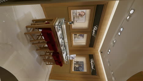 Vertical-View-Of-A-Store-Counter-Showcasing-Chopard-Luxury-Brand-Of-Wristwatch