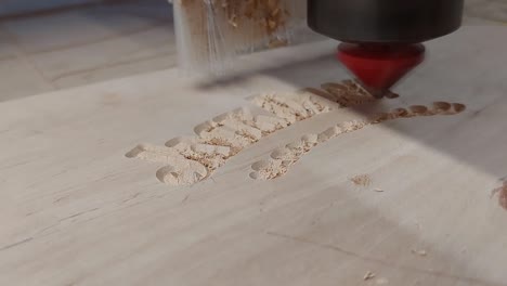 CNC-Router-Carving-Text-on-Wooden-Cutting-Plate