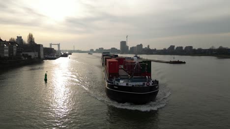 Cargo-ship-Themhof-sailing-in-the-port-of-Dordrecht-with-container-cargo