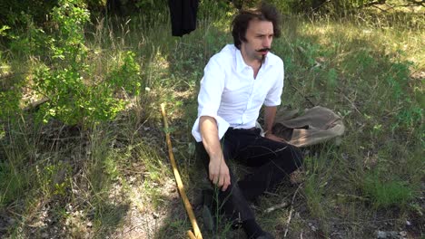 Hungarian-poet-Sandor-Petofi-sits-in-shady-spot-during-hike-to-rest