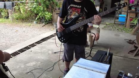 A-dynamic-footage-of-a-bass-guitarist-while-performing-with-his-electric-guitar