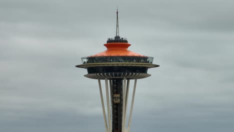 Tight-shot-of-the-Space-Needle-in-Washington-State-with-one-of-its-three-elevators-reaching-the-top
