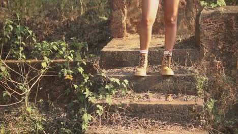 Footage-of-girl's-legs-and-boots-standing-on-a-stair