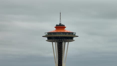 Tight-aerial-view-of-the-Seattle-Space-Needle-on-a-cloudy-day