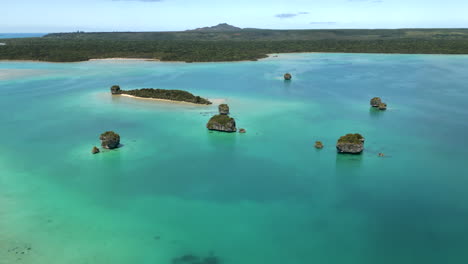 The-rock-islets-in-Upi-Bay-on-the-Isle-of-Pines-in-New-Caledonia---aerial-parallax-panorama