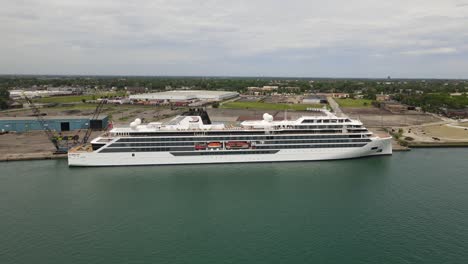 Norwegian-Cruise-Ship,-Viking-Octantis,-docked-in-Detroit-MIchigan,-aerial-view-from-side