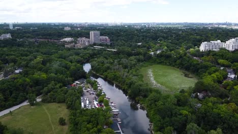 Aerial-view-of-a-river-running-through-green-space-on-an-overcast-day-in-Etobicoke
