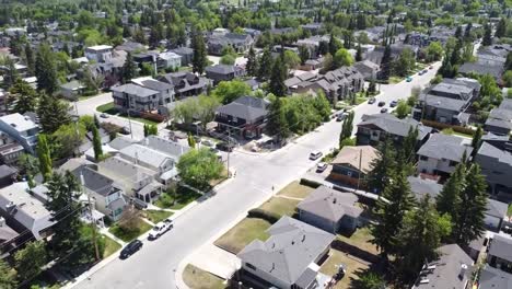 Aerial-shot-panning-up-over-Calgary-neighborhood-on-a-sunny-day-in-summer