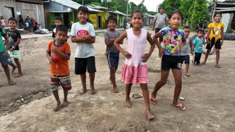 Playful-native-american-children-kid-in-the-countryside,-jungle-rainforest-of-Peru