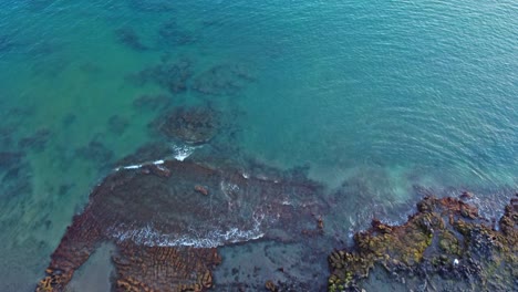 Aerial-view-of-turquoise-calm-ocean-coastline-in-Los-Cristianos-in-Tenerife