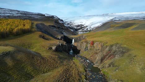 Idyllic-Aerial-View-of-Waterfalls-on-Serene-Iceland-Mountainside-in-Springtime