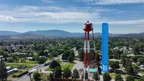 Aerial-view-of-a-water-tower-in-Spokane,-Washington-with-an-animated-bar-depicting-the-facility's-low-water-level