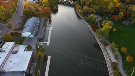 Drone-flying-toward-a-rower-on-a-Mississauga-river-at-sunrise
