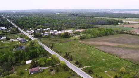 Aerial-shot-flying-over-rural-East-Gwillimbury,-Ontario-on-an-overcast-day