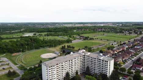 Aerial-shot-of-apartment-buildings-next-to-fields-in-Grimsby