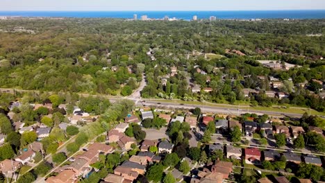 Aerial-shot-flying-over-sunny-suburbs-of-Mississauga-near-Lake-Ontario