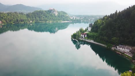 Aerial-view-of-Lake-Bled's-shoreline-on-a-warm-summer-day