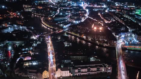 Galway-city-centre-aerial-timelapse-of-nightlife-and-bustling-bridges-over-river-Corrib,-Stunning-Ireland-cityscape