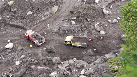 The-activity-of-sand-miners-and-trucks-carrying-and-scraping-sand-in-the-Gendol-river-which-is-the-cold-lava-route-of-Mount-Merapi