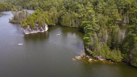 Drone-circling-over-kayakers-on-a-sunny-lake-in-Guelph