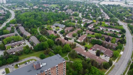 Flying-towards-Mississauga-apartment-buildings-and-houses-on-an-overcast-day