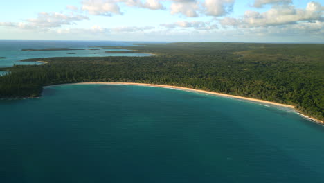 Untouched,-pristine-beach-on-the-Isle-of-Pines,-New-Caledonia---aerial-view-at-sunset