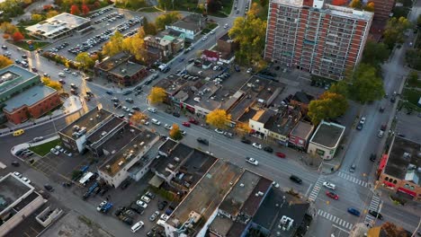 Drone-flying-over-downtown-shops-in-Mississauga-at-sunrise