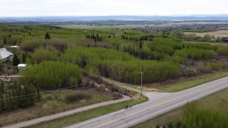 Drone-flying-up-and-over-forest-on-the-outskirts-of-Calgary