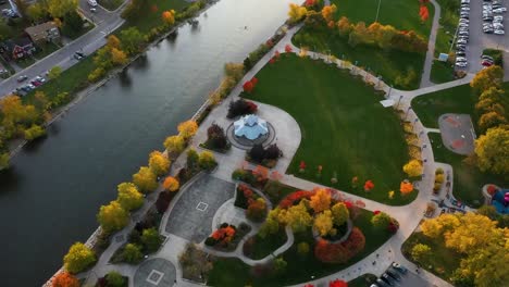 Aerial-view-of-a-river-flowing-past-a-Mississauga-park-at-sunrise