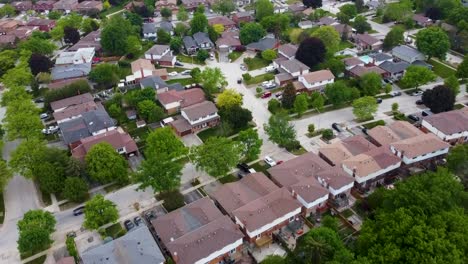 Flying-over-the-roofs-of-Mississauga-houses-on-a-summer-day