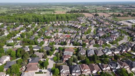 Slowly-circling-over-a-Guelph-suburb-with-a-pond-nestled-in-between-houses
