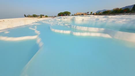 Flying-over-the-travertines-in-Pamukkale,-Turkey