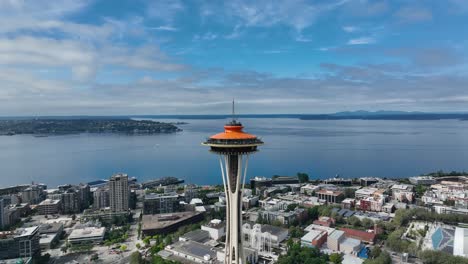 Wide-aerial-view-of-the-Seattle-Space-Needle-with-the-Puget-Sound-in-the-backdrop