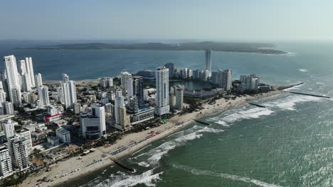 Aerial-view-overlooking-the-coast-of-Bocagrande,-sunny-day-in-Cartagena,-Colombia