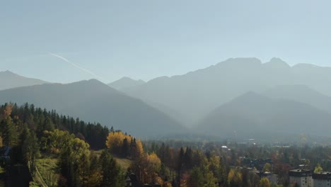 Majestic-Tatra-mountains-range-and-Zakopane-city,-Poland-in-hazy-autumn-sunlight